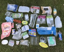 Plastic packaging spread out on grass