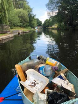 bucket of rubbish on a paddle board