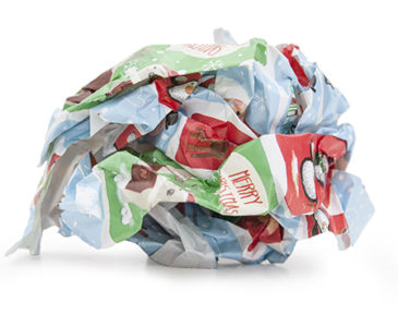 A scrunched up ball of Christmas wrapping paper