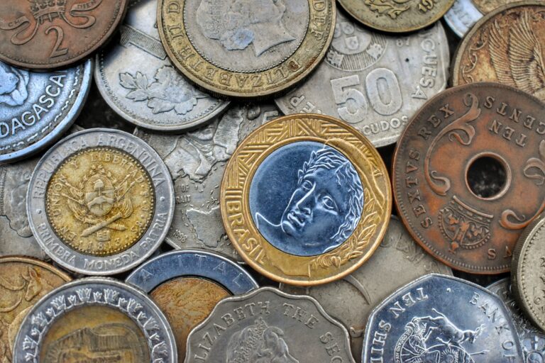 Image of old coins from different countries.