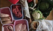 meat, cheese, bread, fruit and vegetables in reusable boxes and bags