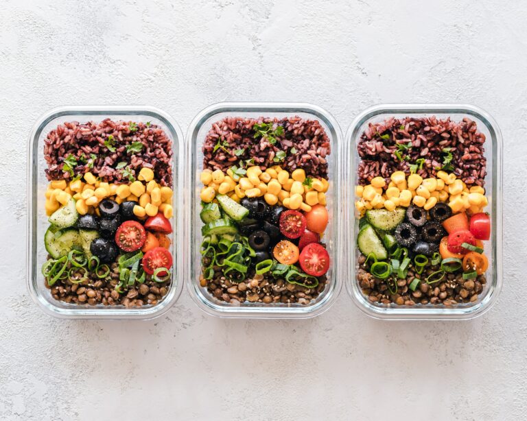 portions of salad in glass containers