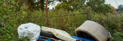 Fly tipped waste on a country road