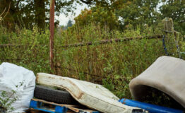 Fly tipped waste on a country road