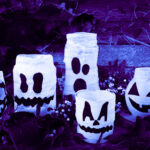 Glass jars decorated to look like ghosts