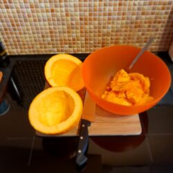 Pumpkin guts scooped out into a bowl