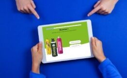 four hands pointing to tablet with question one of quiz