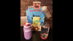 Captain recycling made from plastic fondue sticks, cereal box, wool, paper, wrapping paper and a toilet roll for his mike.