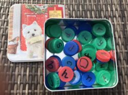 Recycled bottle tops with letters on their tops