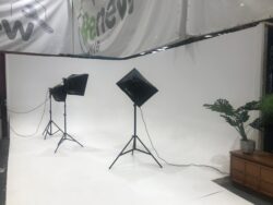Image of a plain white studio with studio lighting