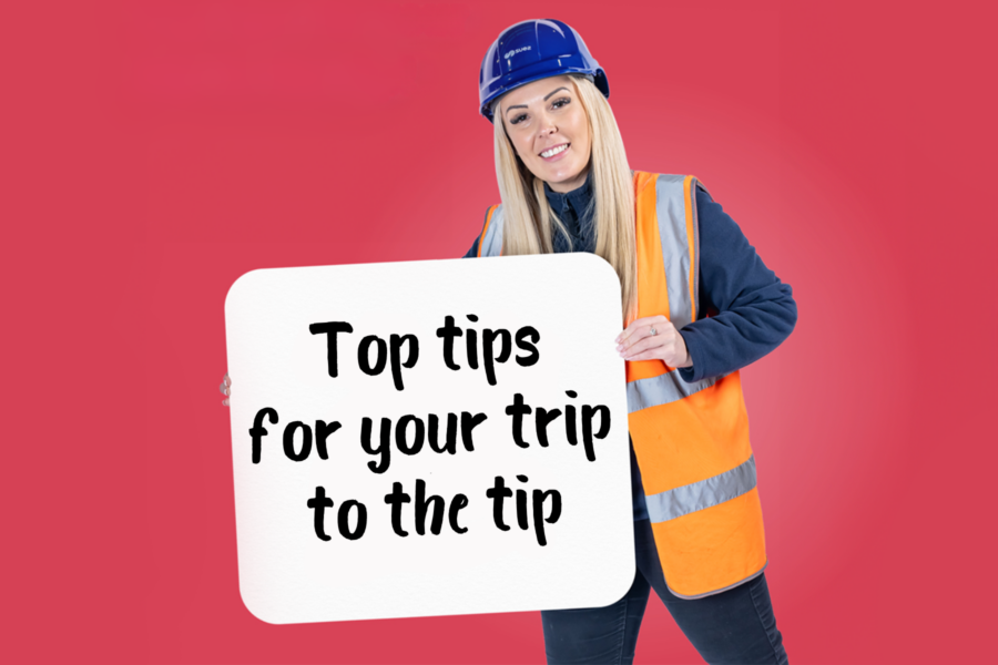 recycling centre worker holding sign saying "Top tips for your trip to the tip"