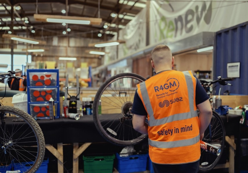 a person fix a bike wheel