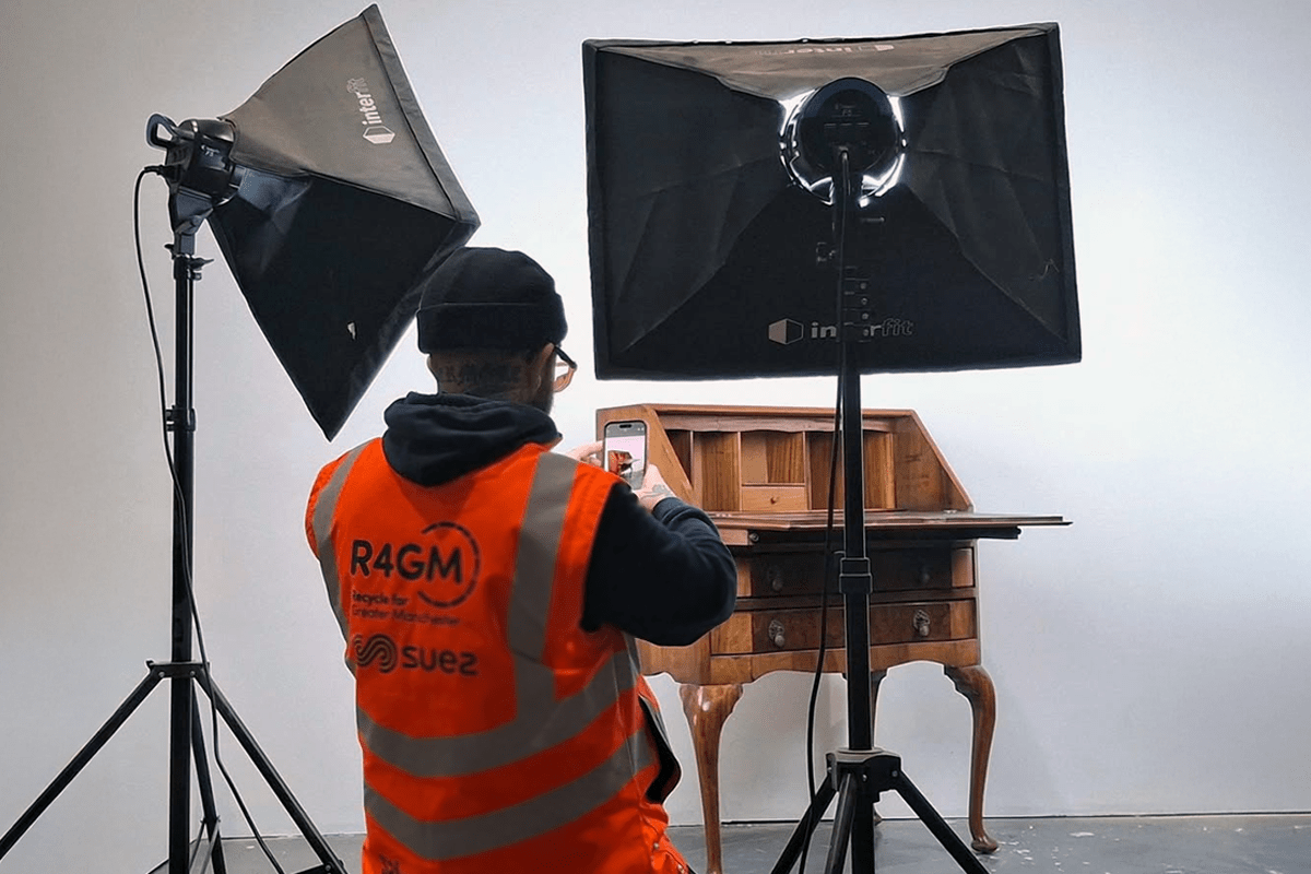 person photographing a vintage sideboard