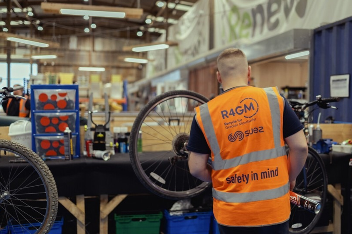 a person fix a bike wheel