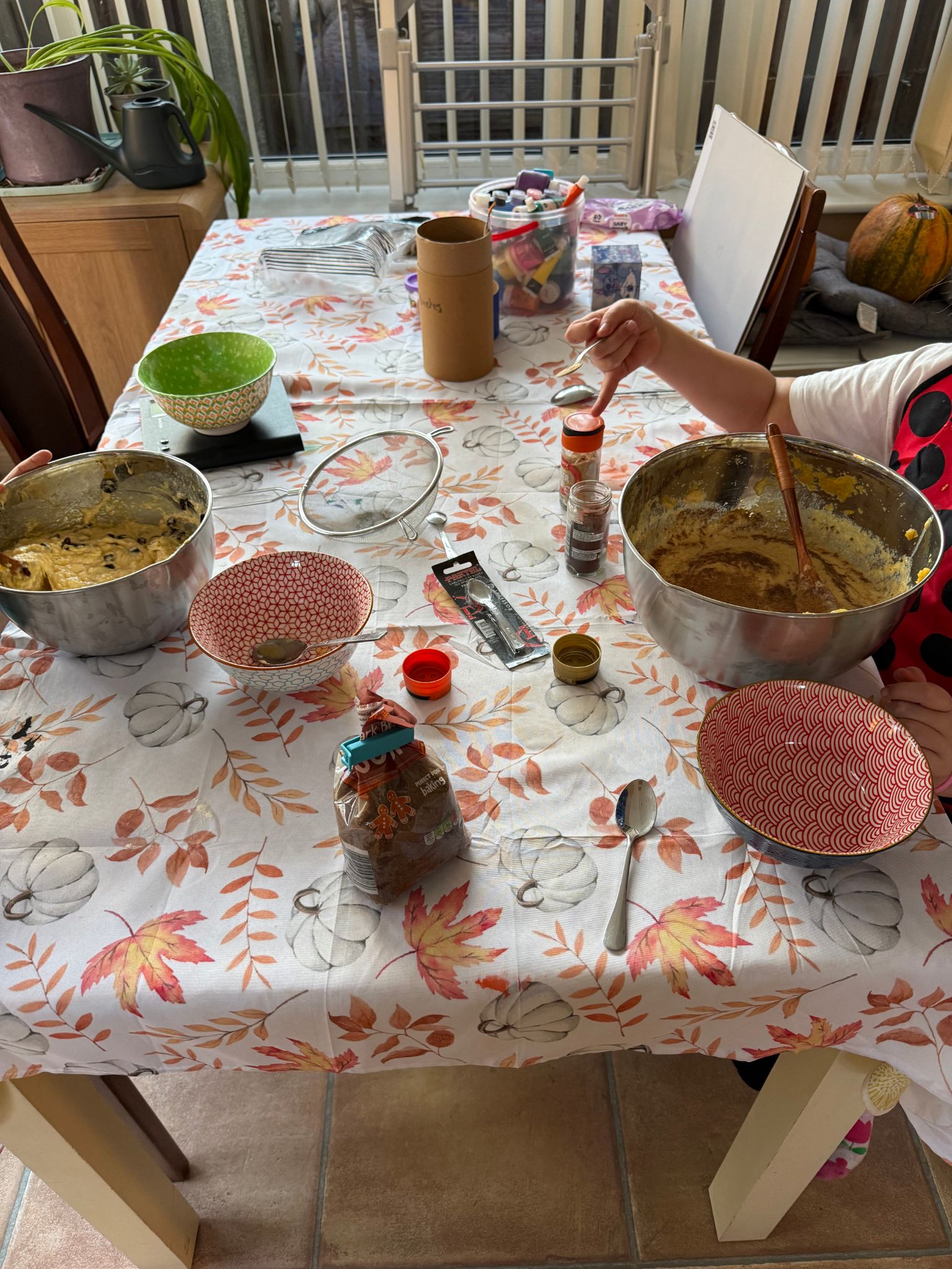 Children mixing pumpkin cakes